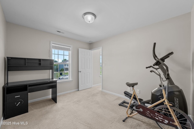 exercise room featuring visible vents, carpet flooring, and baseboards