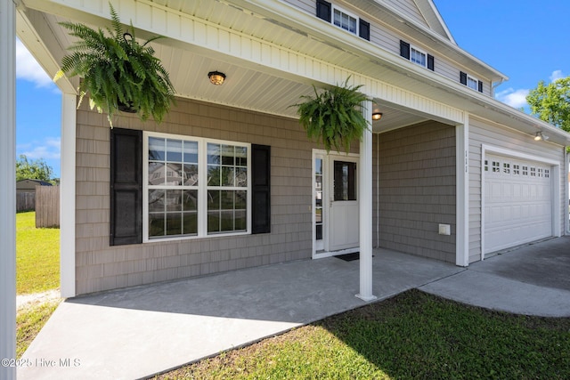 view of exterior entry featuring a garage