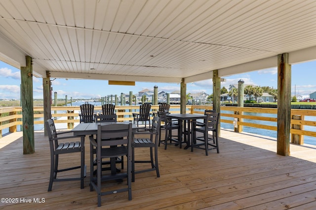 602 W Fort Macon Rd Unit 135, Atlantic Beach, NC 28512 - wooden terrace with a water view and outdoor dining space