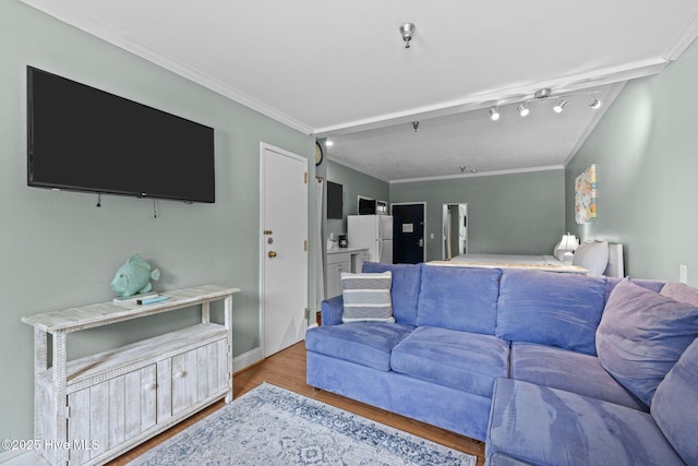 602 W Fort Macon Rd Unit 135, Atlantic Beach, NC 28512 - living room featuring baseboards, ornamental molding, and light wood finished floors