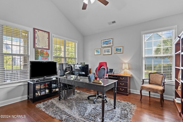 office space with dark wood-style flooring, ceiling fan, visible vents, and a wealth of natural light