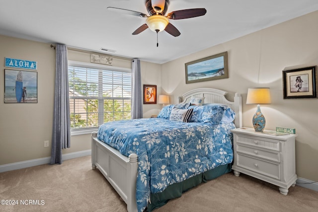 909 Tidalwalk Dr, Wilmington, NC 28409 - bedroom with light carpet, baseboards, and a ceiling fan