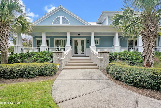 view of front of property with a porch and french doors