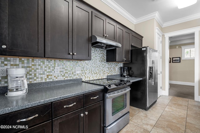 kitchen featuring crown molding, dark countertops, under cabinet range hood, appliances with stainless steel finishes, and backsplash
