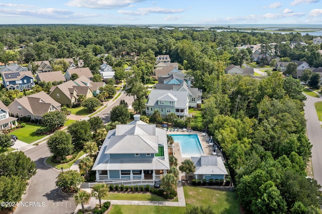 aerial view with a residential view and a view of trees