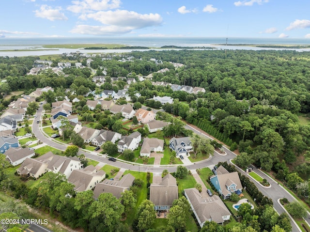 drone / aerial view featuring a residential view and a water view