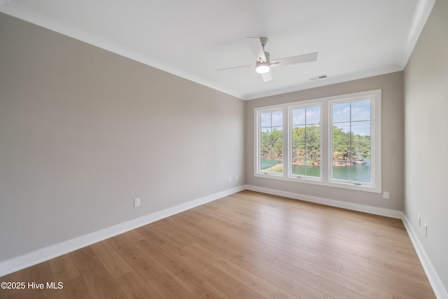 2652 Alvernia Dr, Castle Hayne, NC 28429 - empty room featuring a ceiling fan, baseboards, light wood-style flooring, and crown molding