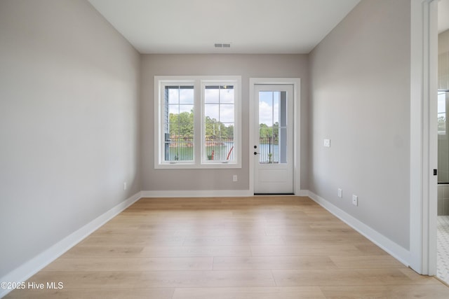 2652 Alvernia Dr, Castle Hayne, NC 28429 - doorway to outside with light wood-type flooring and baseboards