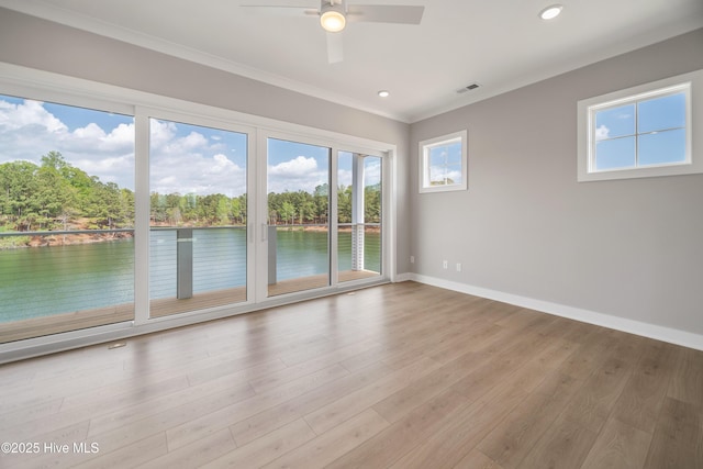2652 Alvernia Dr, Castle Hayne, NC 28429 - unfurnished room featuring a water view, baseboards, ornamental molding, a ceiling fan, and wood finished floors
