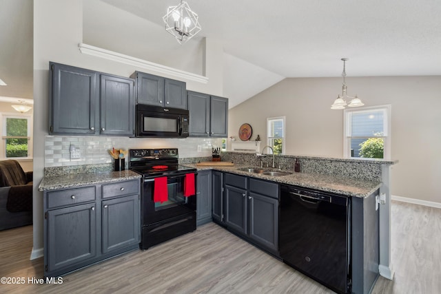 2686 Idlebrook Cir, Midway Park, NC 28544 - kitchen featuring black appliances, a sink, a peninsula, a chandelier, and light wood-style flooring