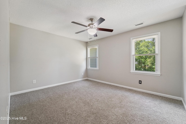 2686 Idlebrook Cir, Midway Park, NC 28544 - carpeted spare room featuring a textured ceiling, ceiling fan, and baseboards