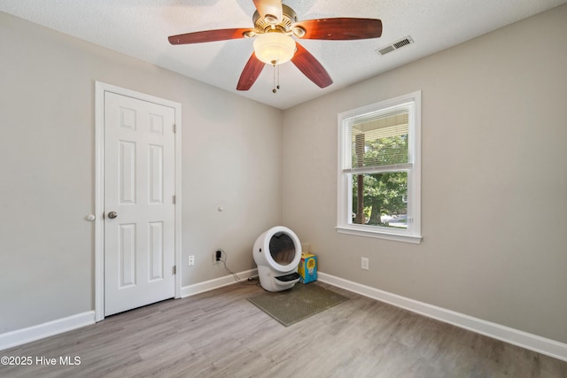 2686 Idlebrook Cir, Midway Park, NC 28544 - empty room with wood finished floors, baseboards, and a ceiling fan