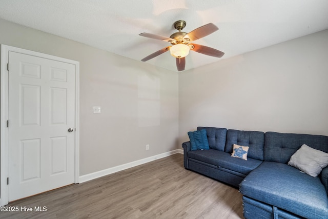 2686 Idlebrook Cir, Midway Park, NC 28544 - living room with light wood-style flooring, ceiling fan, and baseboards