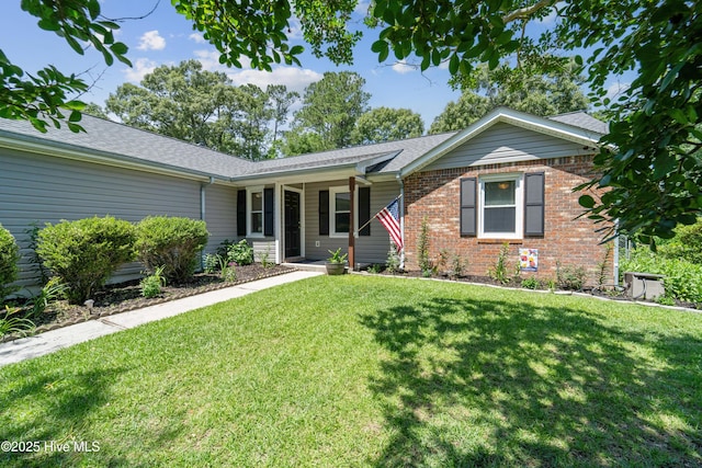 2686 Idlebrook Cir, Midway Park, NC 28544 - single story home featuring brick siding, a front lawn, roof with shingles, and covered porch