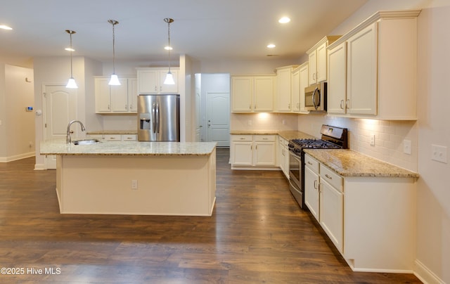 5225 National Garden Trl, Winnabow, NC 28479 - kitchen with a sink, stainless steel appliances, baseboards, recessed lighting, and decorative backsplash