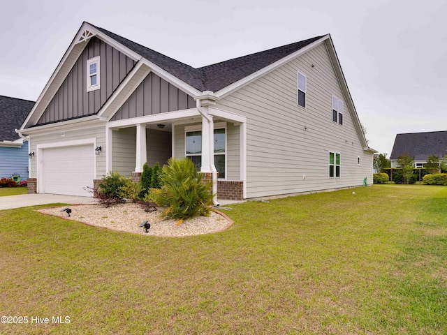 5225 National Garden Trl, Winnabow, NC 28479 - view of front of home featuring board and batten siding, a porch, roof with shingles, a front yard, and concrete driveway