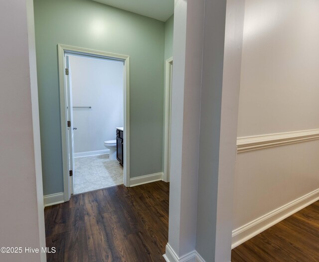5225 National Garden Trl, Winnabow, NC 28479 - corridor with baseboards and dark wood finished floors