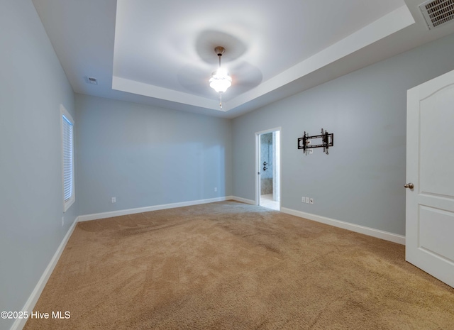 5225 National Garden Trl, Winnabow, NC 28479 - empty room with a raised ceiling, ceiling fan, carpet flooring, and visible vents