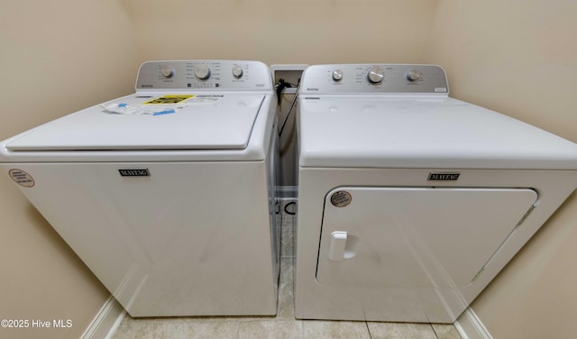 5225 National Garden Trl, Winnabow, NC 28479 - laundry room featuring light tile patterned floors and washer and clothes dryer