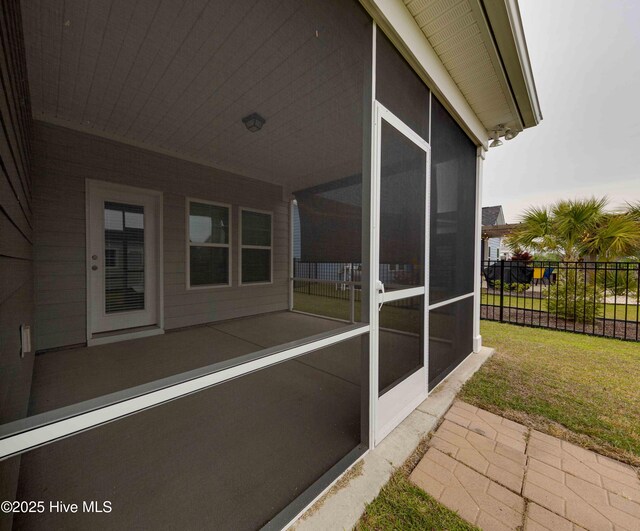 5225 National Garden Trl, Winnabow, NC 28479 - view of patio / terrace featuring fence and a sunroom