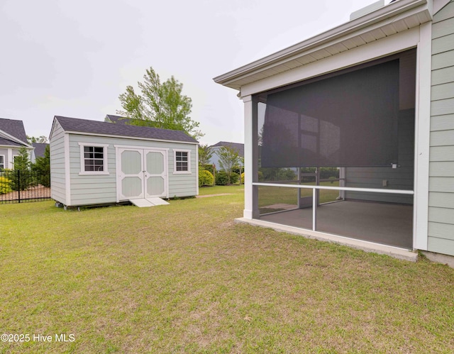 5225 National Garden Trl, Winnabow, NC 28479 - view of yard with a storage shed, fence, an outbuilding, and a sunroom