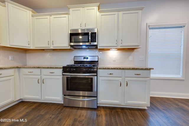 5225 National Garden Trl, Winnabow, NC 28479 - kitchen with decorative backsplash, pendant lighting, a fireplace, dark wood-style floors, and stainless steel appliances
