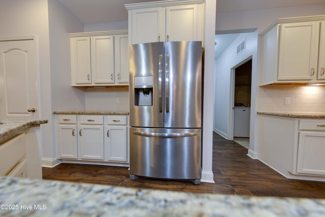 5225 National Garden Trl, Winnabow, NC 28479 - kitchen with stainless steel fridge with ice dispenser, baseboards, dark wood finished floors, and visible vents