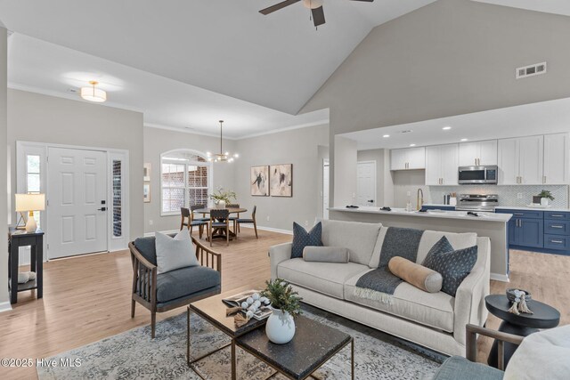 113 Rockledge Rd, Wilmington, NC 28412 - living room with light wood-style floors, ceiling fan with notable chandelier, and visible vents