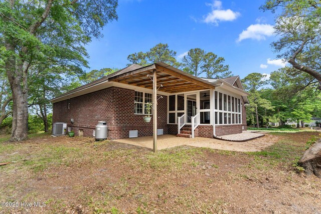 113 Rockledge Rd, Wilmington, NC 28412 - rear view of property with crawl space, a patio area, a sunroom, brick siding, and cooling unit