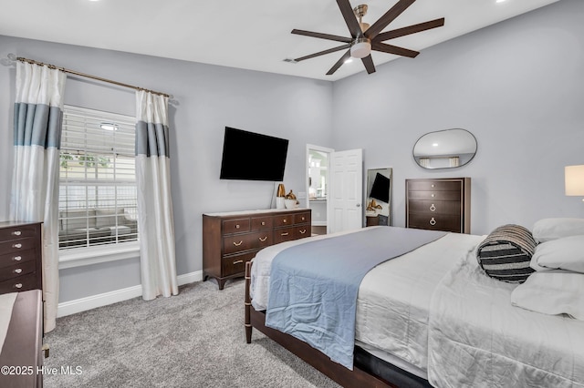 bedroom with baseboards, a ceiling fan, high vaulted ceiling, and light colored carpet