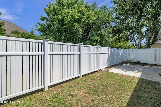view of yard with a patio and a fenced backyard