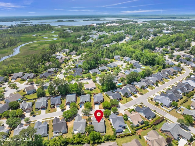 aerial view featuring a water view, golf course view, and a residential view