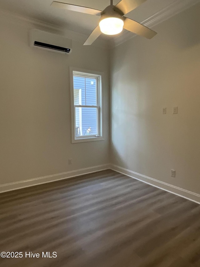 unfurnished room featuring dark wood-type flooring, a wall mounted air conditioner, baseboards, and a ceiling fan