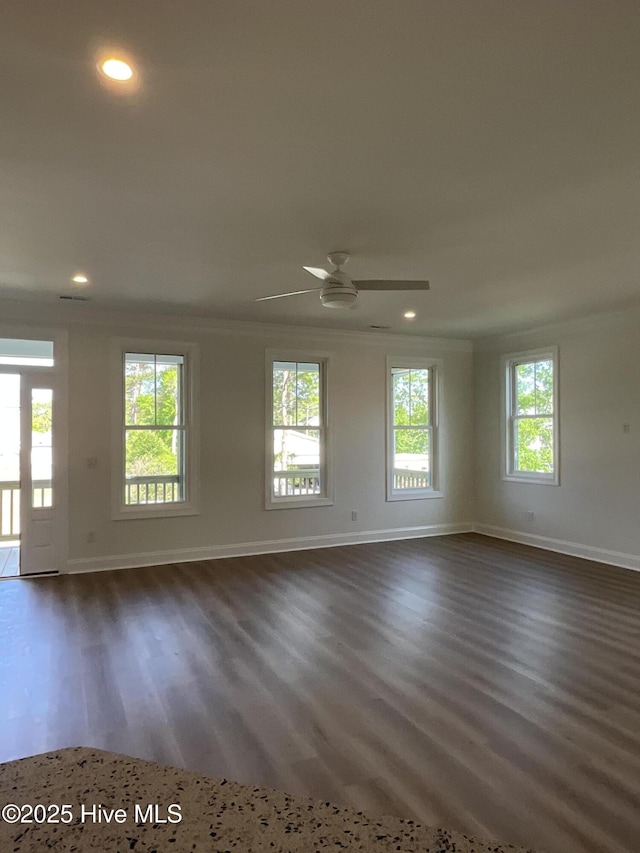 empty room with baseboards, recessed lighting, a ceiling fan, and dark wood-type flooring
