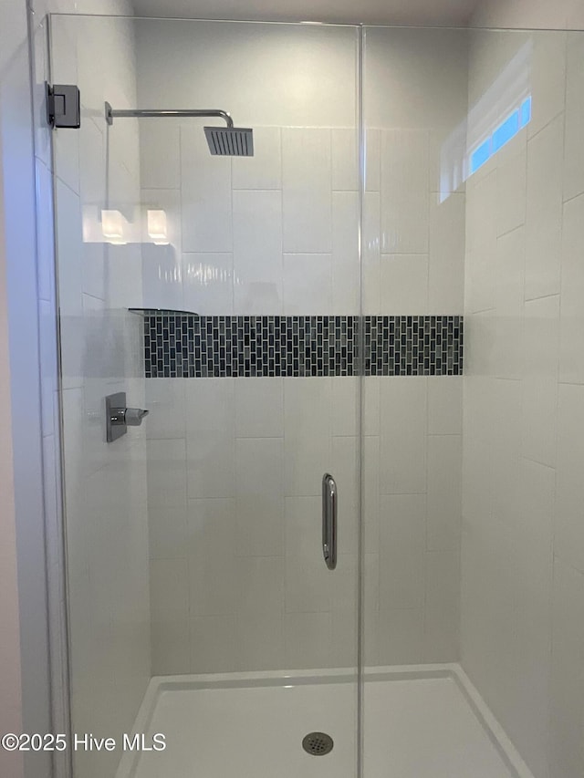 full bathroom with a shower stall