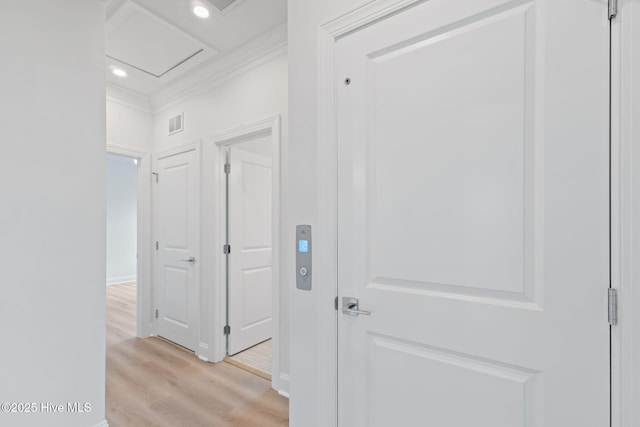 226 NE 64th St, Oak Island, NC 28465 - hall with light wood-style flooring, crown molding, attic access, recessed lighting, and baseboards