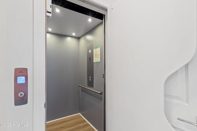 226 NE 64th St, Oak Island, NC 28465 - elevator with wood finished floors and recessed lighting