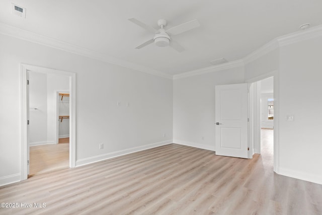 226 NE 64th St, Oak Island, NC 28465 - empty room featuring ornamental molding, light wood-style floors, a ceiling fan, and baseboards