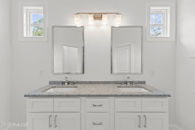 226 NE 64th St, Oak Island, NC 28465 - bathroom with plenty of natural light and double vanity