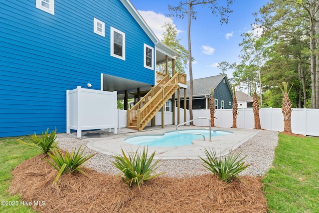 226 NE 64th St, Oak Island, NC 28465 - view of swimming pool featuring stairs, fence, and a patio area