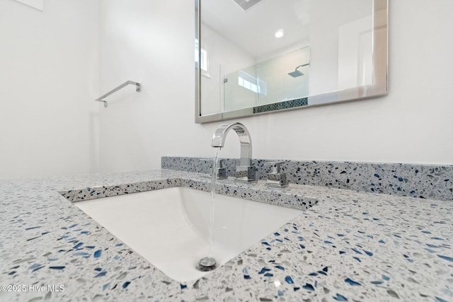 226 NE 64th St, Oak Island, NC 28465 - bathroom featuring a sink, walk in shower, and recessed lighting