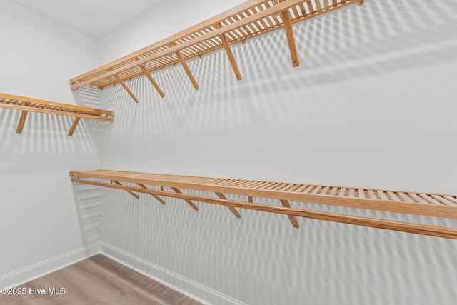 226 NE 64th St, Oak Island, NC 28465 - spacious closet featuring wood finished floors
