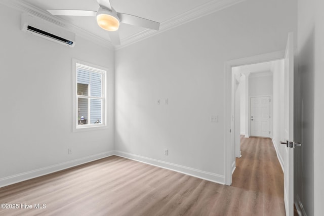 226 NE 64th St, Oak Island, NC 28465 - empty room featuring a wall mounted AC, light wood-type flooring, crown molding, baseboards, and a ceiling fan