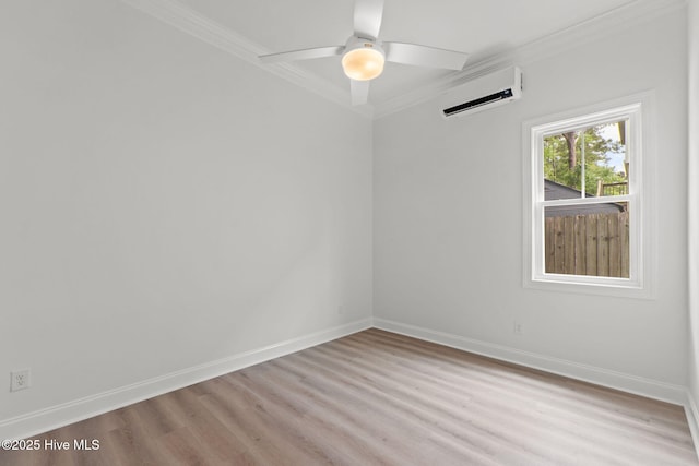 226 NE 64th St, Oak Island, NC 28465 - spare room with an AC wall unit, ornamental molding, wood finished floors, and baseboards