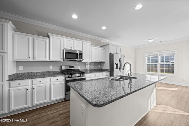 kitchen featuring a sink, ornamental molding, stainless steel appliances, white cabinetry, and dark wood-type flooring