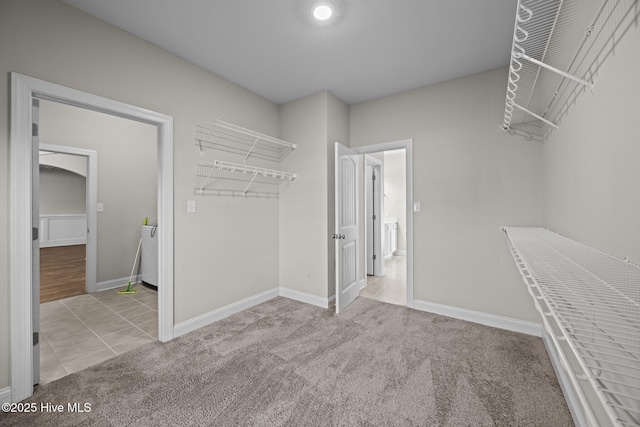 walk in closet featuring carpet floors