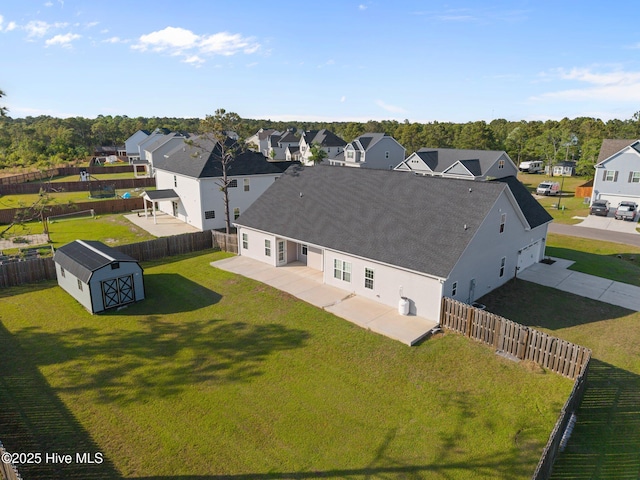 birds eye view of property with a residential view
