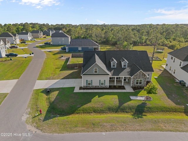 bird's eye view with a view of trees and a residential view