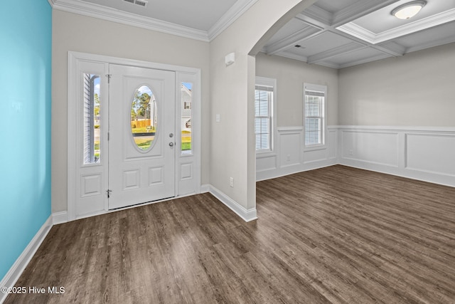 entryway with crown molding, arched walkways, beamed ceiling, and wood finished floors