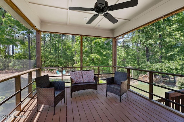 wooden deck with ceiling fan and an outdoor hangout area